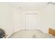 Bright bedroom featuring neutral walls, carpet, a closet, and a door, offering a cozy and functional space at 1139 Maple Stream Dr, Indianapolis, IN 46217