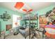 Fun ' bedroom with loft bed, desk, couch, and lots of toys at 1139 Maple Stream Dr, Indianapolis, IN 46217