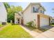 Charming two-story home with a well-maintained lawn, attached garage, and inviting front entrance at 1139 Maple Stream Dr, Indianapolis, IN 46217