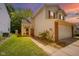 Charming two-story home features a brick accent, a well-manicured lawn, and an attached two-car garage at 1139 Maple Stream Dr, Indianapolis, IN 46217