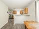 Kitchen and dining area with stainless steel refrigerator and wooden cabinets at 1139 Maple Stream Dr, Indianapolis, IN 46217