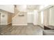Open living room with staircase features neutral walls, wood floors, and modern decor at 1139 Maple Stream Dr, Indianapolis, IN 46217