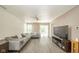 Spacious living room features an oversized sectional, wood floors, and sliding glass doors to the exterior at 1139 Maple Stream Dr, Indianapolis, IN 46217