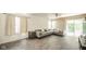 Bright living room features a large sectional, wood floors, and sliding glass doors to the exterior at 1139 Maple Stream Dr, Indianapolis, IN 46217