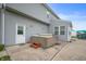 A backyard with a hot tub and gray siding on a sunny day at 1143 Hampton Dr, Greenwood, IN 46143
