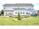 Spacious backyard featuring a custom stone retaining wall and outdoor seating area at 1143 Hampton Dr, Greenwood, IN 46143