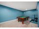 Finished basement featuring a pool table, carpet flooring, and accent lighting at 1143 Hampton Dr, Greenwood, IN 46143