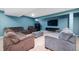 Finished basement featuring multiple sofas, a television, and carpeted flooring at 1143 Hampton Dr, Greenwood, IN 46143