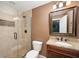 Bathroom features an updated vanity, a tile shower with glass door and granite countertop at 1143 Hampton Dr, Greenwood, IN 46143