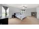 Bedroom featuring a stone fireplace, carpeted floor, and modern ceiling fan at 1143 Hampton Dr, Greenwood, IN 46143