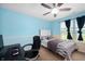 Study and bedroom with a desk, carpet, ceiling fan and a window for natural light at 1143 Hampton Dr, Greenwood, IN 46143