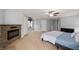 Spacious bedroom with an electric fireplace, neutral walls, and plush carpeting at 1143 Hampton Dr, Greenwood, IN 46143