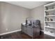 Home office space with a built-in bookshelf, desk and neutral paint at 1143 Hampton Dr, Greenwood, IN 46143