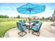Outdoor patio with a table, chairs and a large umbrella at 1143 Hampton Dr, Greenwood, IN 46143