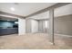 Neutral room with carpet and support beam showing entry to living space through white doors at 1143 Hampton Dr, Greenwood, IN 46143