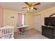 Cozy bedroom with a white crib, window with natural light, and dresser at 1159 Oak Leaf Rd, Franklin, IN 46131