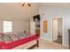 The main bedroom has vaulted ceiling, carpeted floors, a TV, and a connected bathroom at 1159 Oak Leaf Rd, Franklin, IN 46131