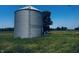 A large, silver grain bin in a grassy field at 1170 E 400 S, Lebanon, IN 46052