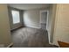 This carpeted bedroom has neutral walls, a window and doorways into other rooms in the home at 12328 Quarry Face Ct, Fishers, IN 46037