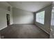 Primary bedroom with vaulted ceiling, neutral walls, carpet and a large window overlooking the yard at 12328 Quarry Face Ct, Fishers, IN 46037