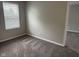 The bedroom has neutral walls, carpet, a window and a doorway into another room in the home at 12328 Quarry Face Ct, Fishers, IN 46037