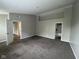 This large bedroom features neutral walls, carpet and doorways into the other rooms in the home at 12328 Quarry Face Ct, Fishers, IN 46037