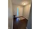 Bright foyer with hardwood flooring and decorative rug near the front door at 12328 Quarry Face Ct, Fishers, IN 46037
