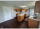 Functional kitchen with an island, wooden cabinets, and laminate countertops at 12328 Quarry Face Ct, Fishers, IN 46037