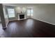 Spacious living room featuring hardwood floors and a fireplace at 12328 Quarry Face Ct, Fishers, IN 46037