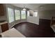 Spacious living room featuring hardwood floors, a fireplace and large windows overlooking the yard at 12328 Quarry Face Ct, Fishers, IN 46037