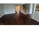 Spacious living room with hardwood floors, stairs, and natural light at 12328 Quarry Face Ct, Fishers, IN 46037