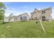 Backyard featuring a swing set, trampoline, shed, and well-manicured lawn at 126 Winding Brook Way, Pendleton, IN 46064