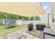 Backyard features a patio with a pergola, trampoline, grill, and outdoor furniture at 126 Winding Brook Way, Pendleton, IN 46064