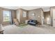 Comfortable bonus room with natural light, ideal for relaxation and entertainment, with a cozy seating area at 126 Winding Brook Way, Pendleton, IN 46064