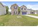 Charming two-story home with brick and siding exterior, a well-manicured lawn, and an attached garage at 126 Winding Brook Way, Pendleton, IN 46064