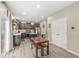Modern kitchen with dark cabinets, stainless steel appliances, and a wooden kitchen table at 126 Winding Brook Way, Pendleton, IN 46064