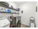Functional laundry room equipped with shelving, modern washer and dryer, and storage solutions at 126 Winding Brook Way, Pendleton, IN 46064