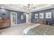 Inviting bedroom with gray walls boasts bathroom and closet entries and decor at 126 Winding Brook Way, Pendleton, IN 46064
