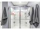 Bright shower space with glass door, caddy, and dual shower heads at 126 Winding Brook Way, Pendleton, IN 46064