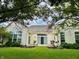 The home's backyard features white siding, sliding glass doors, well-maintained landscaping, and a patio at 12656 Cerromar Ct, Carmel, IN 46033