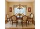 Traditional dining room with a wood table, seating for six, and chandelier at 12656 Cerromar Ct, Carmel, IN 46033