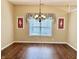 Bright dining room featuring a chandelier and a large window at 12656 Cerromar Ct, Carmel, IN 46033