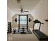 Home gym features a squat rack, free weights, kettle bells and a treadmill at 12656 Cerromar Ct, Carmel, IN 46033