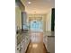 Open kitchen with granite countertops, white cabinets and natural light coming from the breakfast area at 12656 Cerromar Ct, Carmel, IN 46033