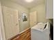 Laundry room equipped with a washer and dryer with additional storage, and a decorative wall design at 12656 Cerromar Ct, Carmel, IN 46033