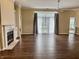 Open living room with fireplace, hardwood floors, and large windows at 12656 Cerromar Ct, Carmel, IN 46033