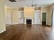 Spacious living room with hardwood floors, fireplace, built-in shelving and natural light at 12656 Cerromar Ct, Carmel, IN 46033