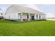 Beautiful backyard featuring a covered patio and spacious lawn at 138 Rock Island Rd, Westfield, IN 46069