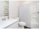 Well-lit bathroom with modern fixtures, white vanity, and shower-tub combination at 138 Rock Island Rd, Westfield, IN 46069