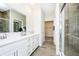 Luxurious bathroom with double vanity, walk-in shower, and modern fixtures at 138 Rock Island Rd, Westfield, IN 46069